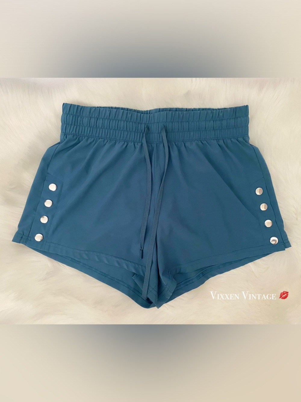 R. SOFIA HIGH WAISTED LINED LEG SNAP RUNNING SHORTS IN TEAL